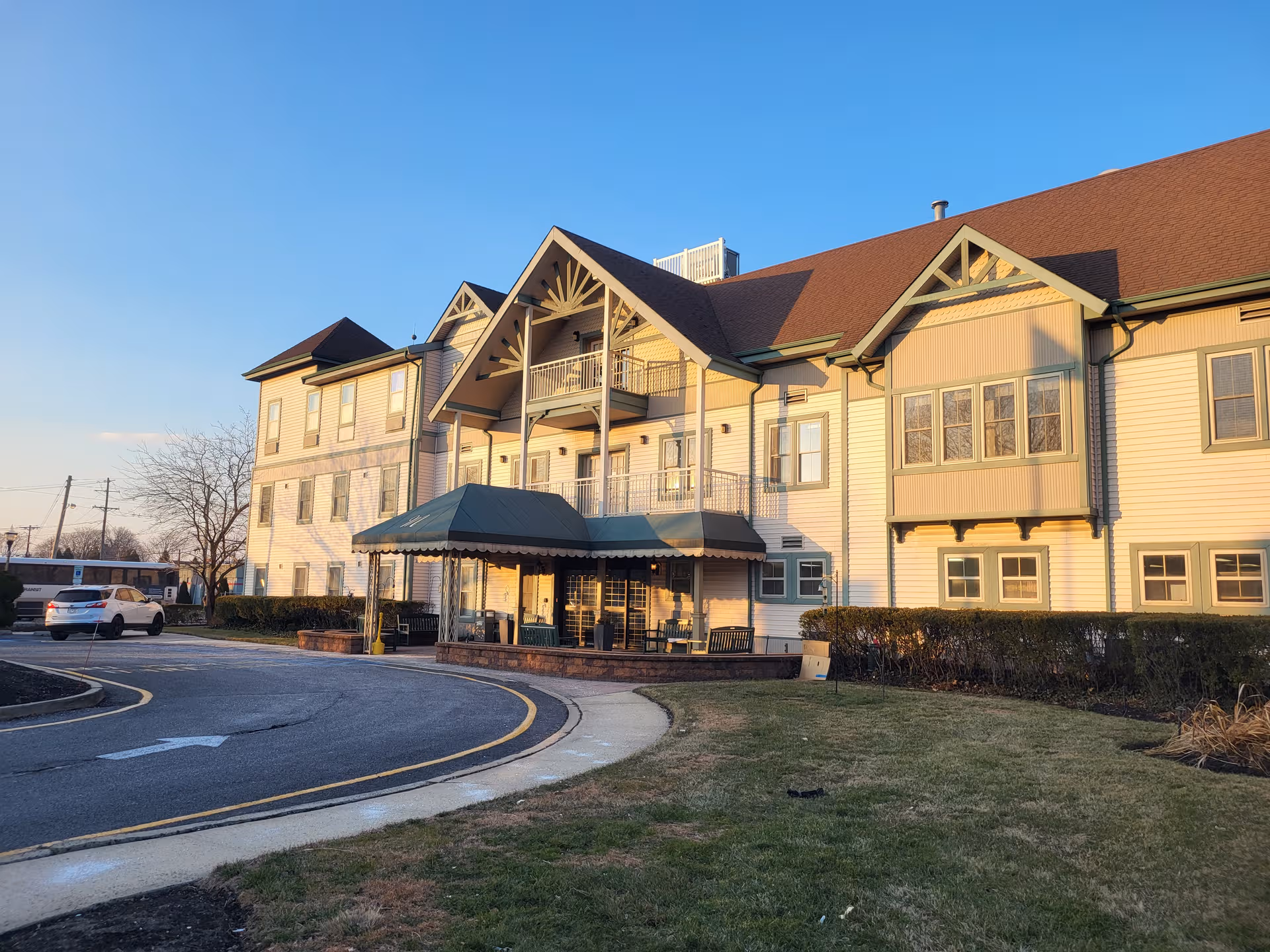 Exterior view of Complete Care at Ocean Grove building with entrance canopy and curved driveway.