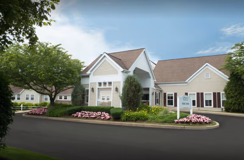 Front of Wingate Residences at Silver Lake, a senior living facility with landscaped entrance.