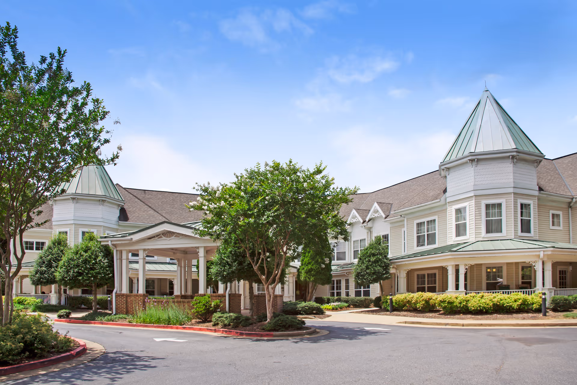 Exterior of Sunrise at East Cobb senior living campus with entrance canopy.