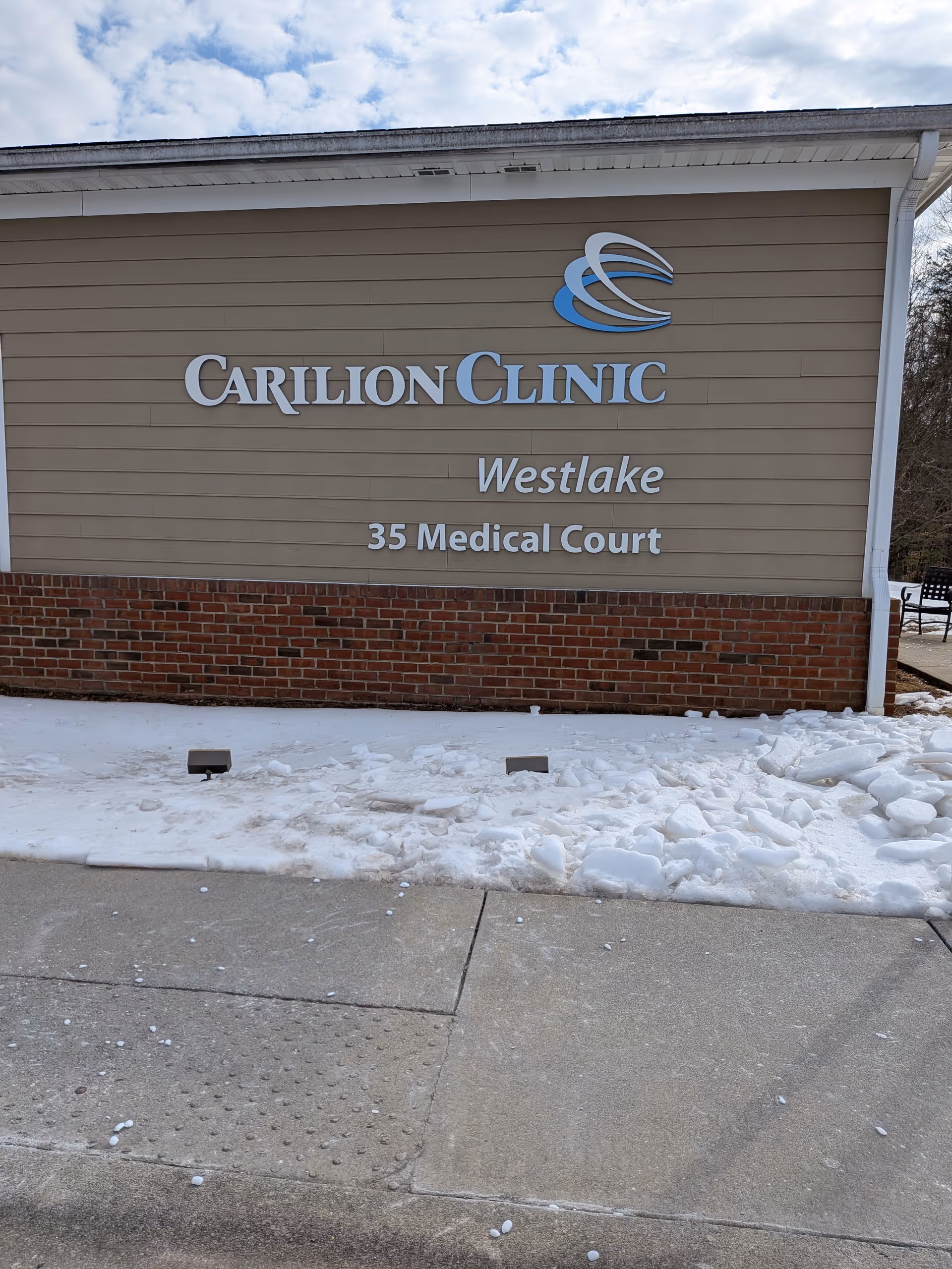 Exterior wall of Carilion Clinic Westlake with snow along the sidewalk