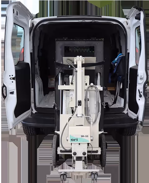 Rear of Landes Mobile Xray van with a mobile X-ray machine inside.