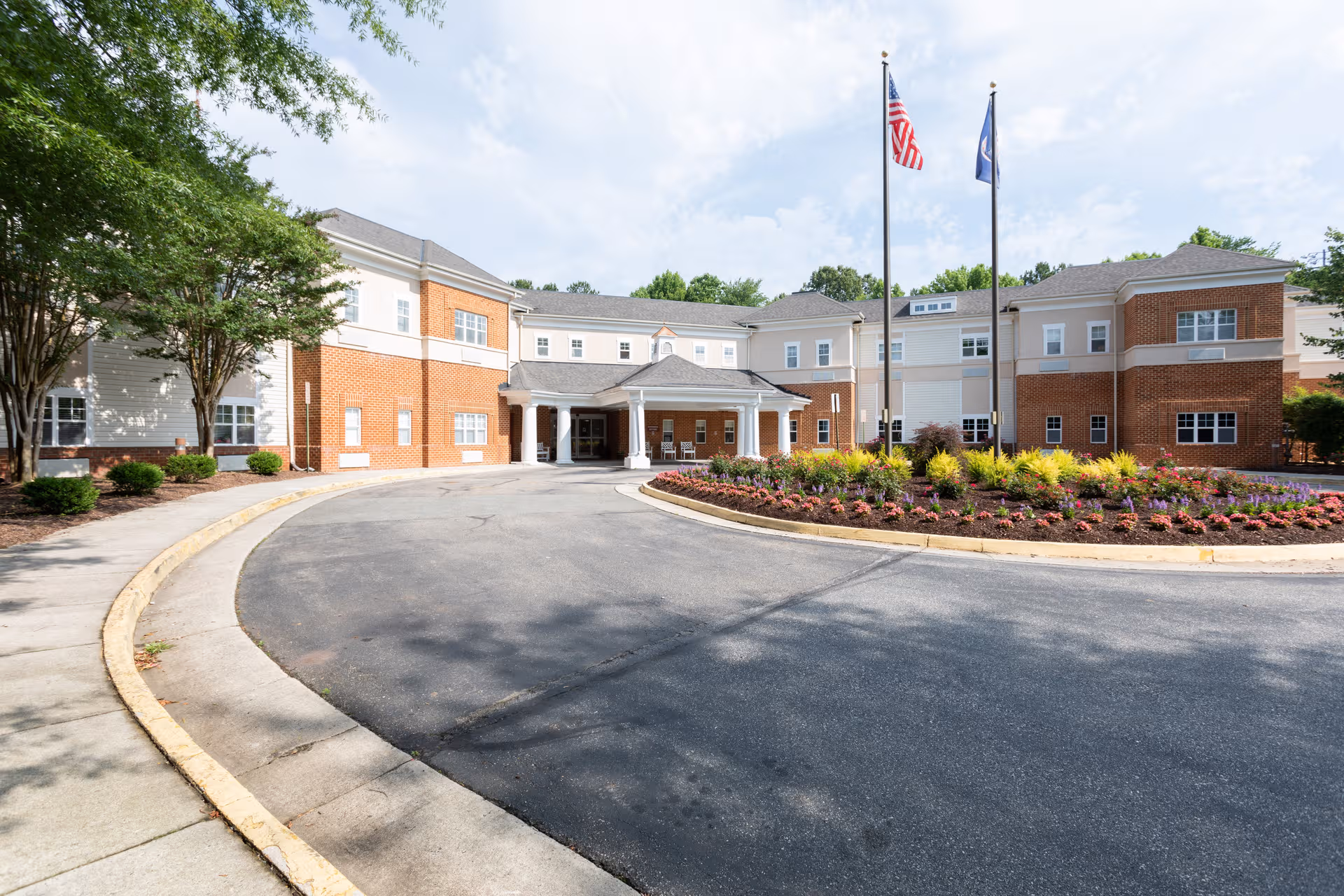 Exterior view of Morningside of Bellgrade showing entrance, circular driveway, and landscaped front.