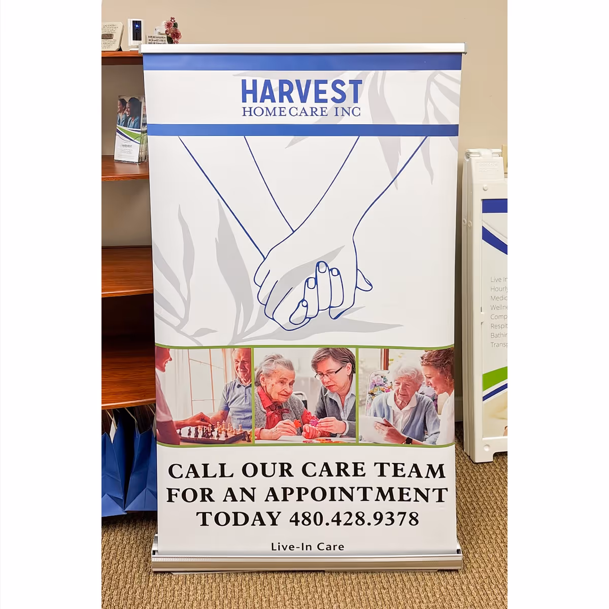 A Harvest Home Care banner displayed in a lobby with contact details.