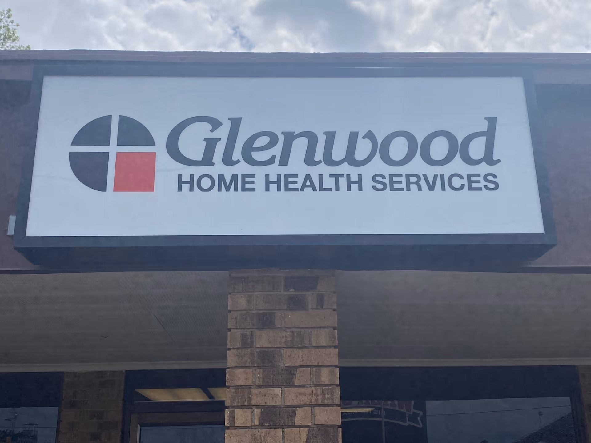 Exterior view of a building with a large Glenwood Home Health Services sign.