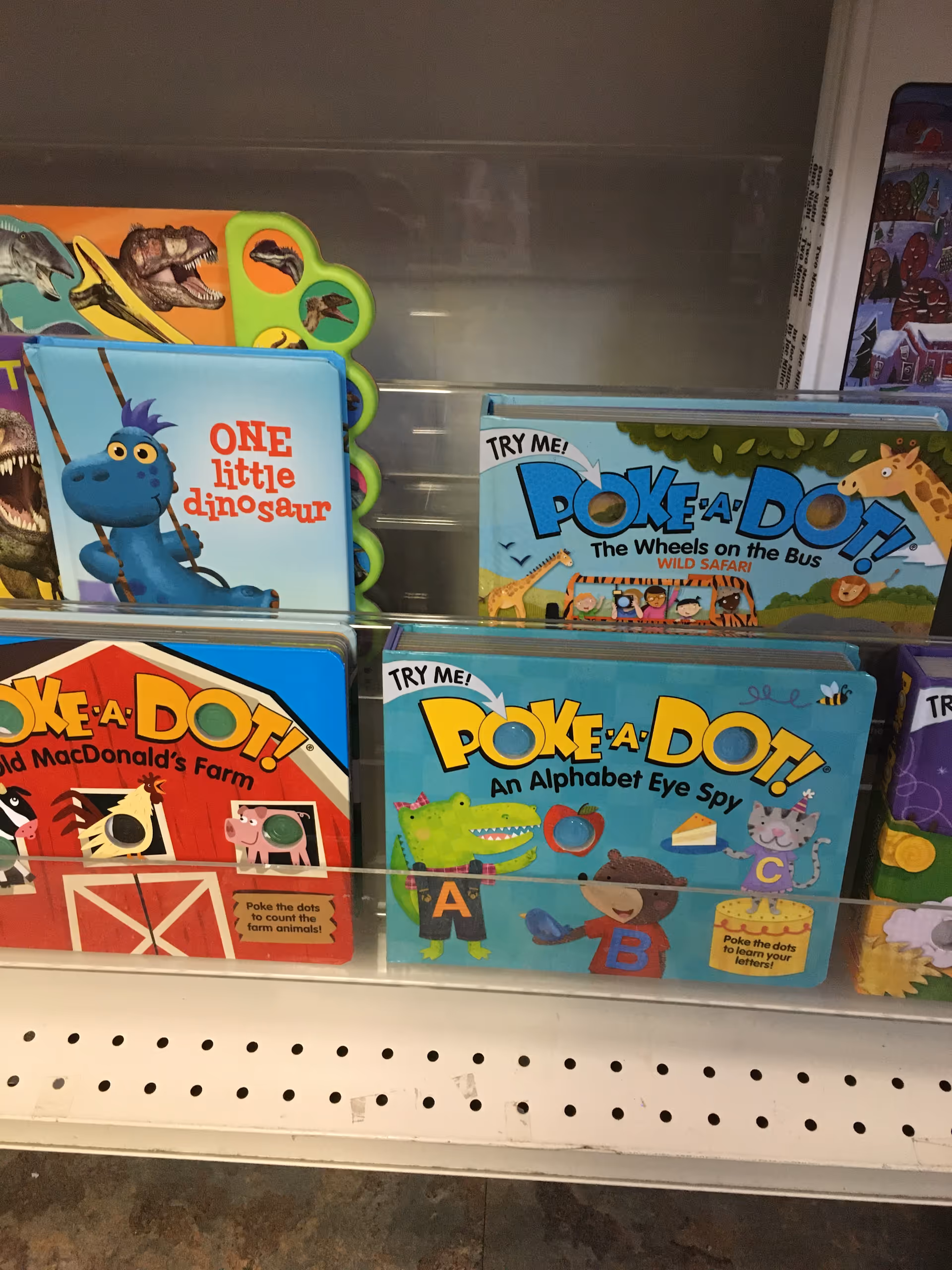 Colorful children's books on a shelf inside Boone Drug & Healthcare at Deerfield.