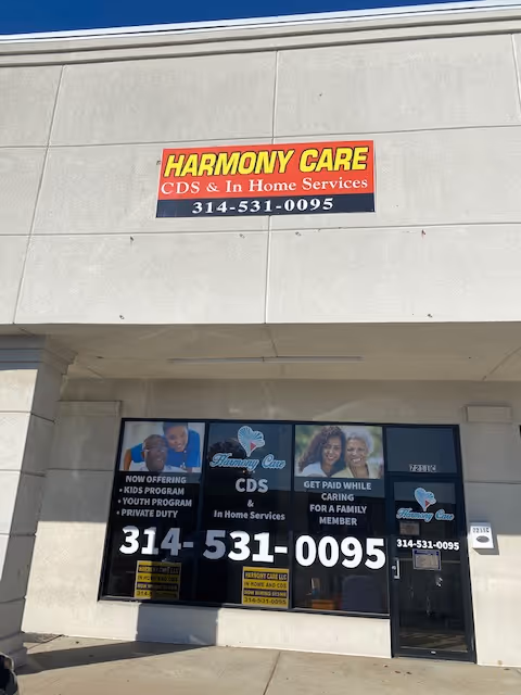 Facade of a Harmony Care building with a prominent sign and entrance.