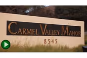 Front sign for Carmel Valley Manor with the address 8545 on a grassy area.