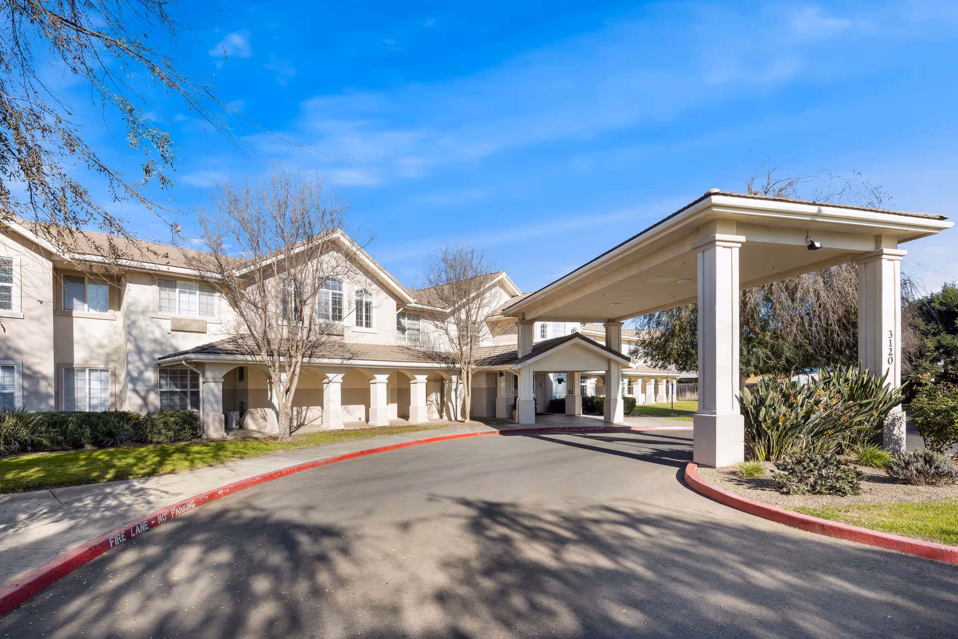 Marbella Visalia senior living exterior with porte-cochère entrance.