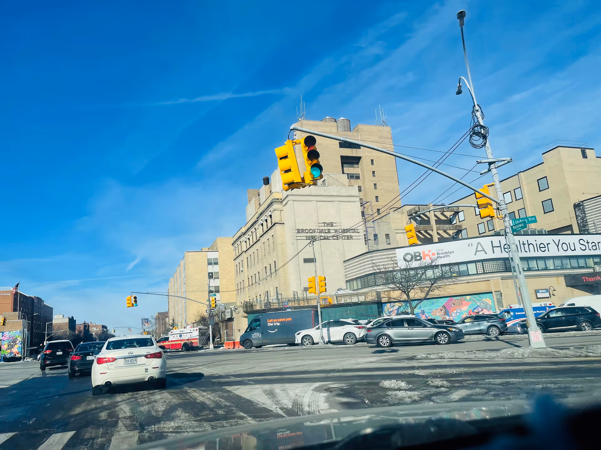 Street view of One Brooklyn Health-Brookdale University Hospital Medical Center with traffic.