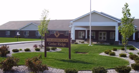Exterior view of Cedar Ridge Health Campus with landscaped grounds and entrance sign.
