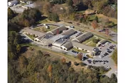 Aerial view of Princeton Health Care Center campus with single-story buildings, trees, and a parking lot.