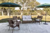Outdoor patio at Windsor Care Center of Petaluma with seating and umbrellas.