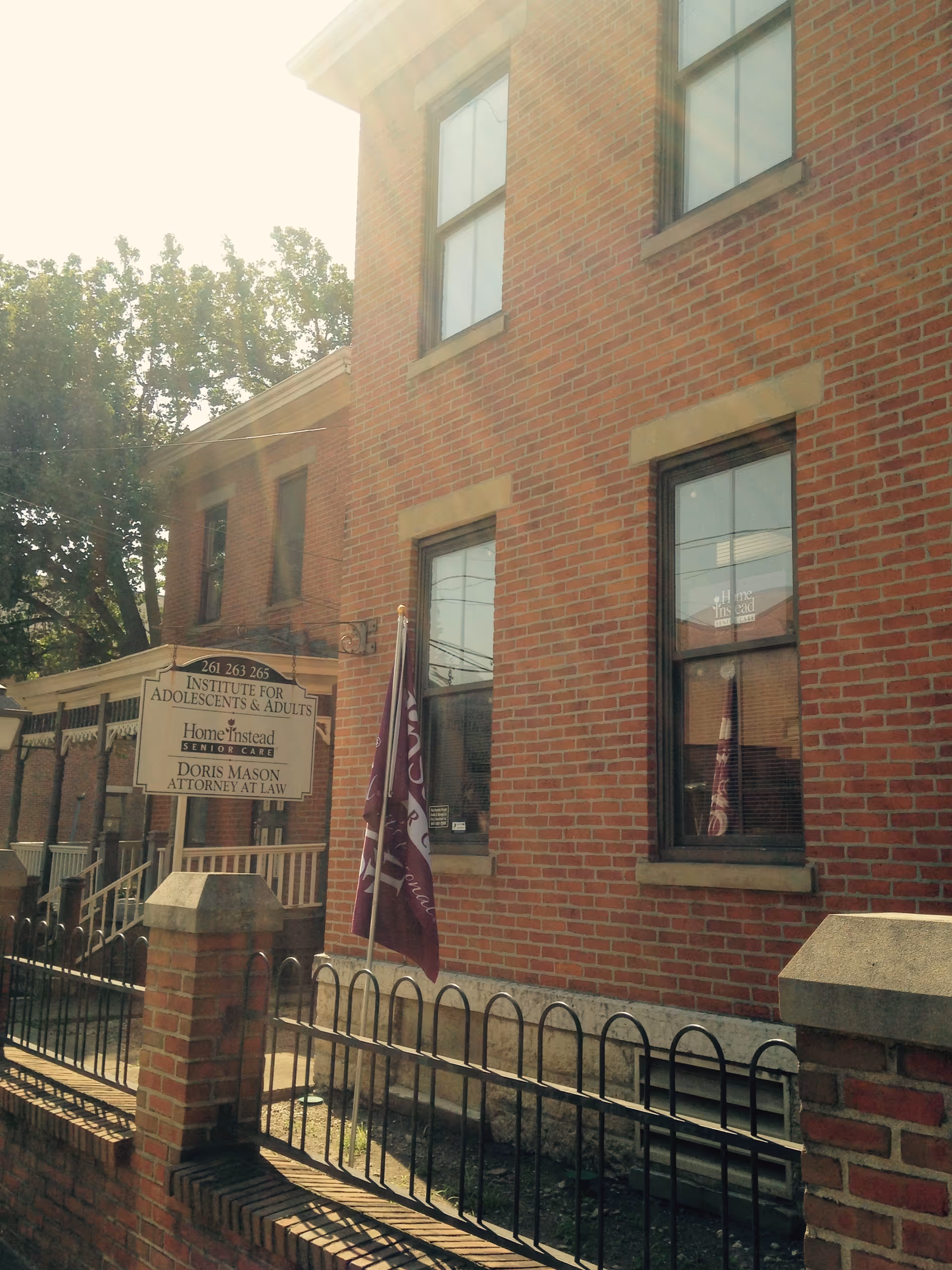 Brick building exterior with a sign for the Institute for Adolescents & Adults.
