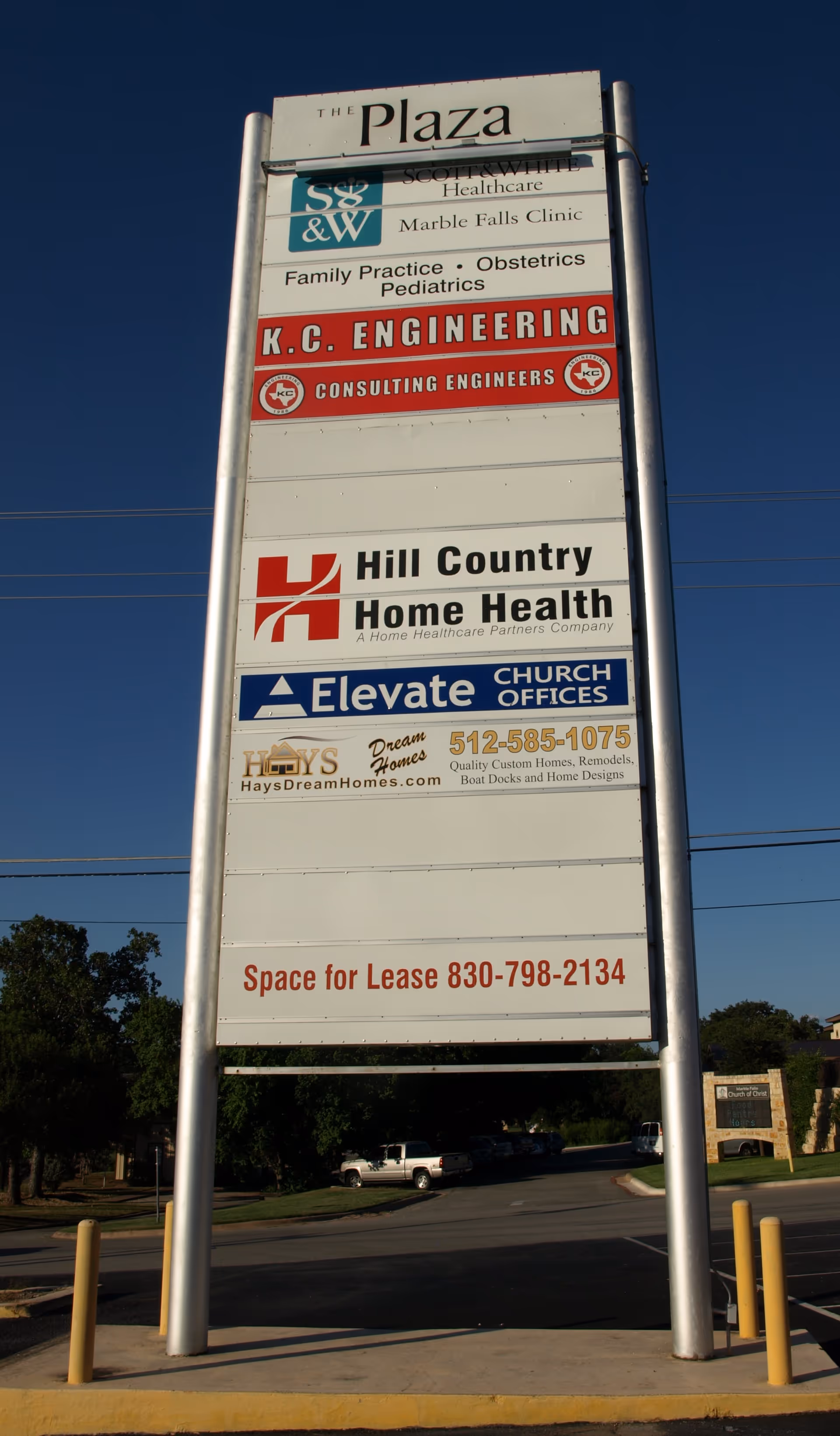 Tall outdoor signboard showing Hill Country Home Health among other businesses.
