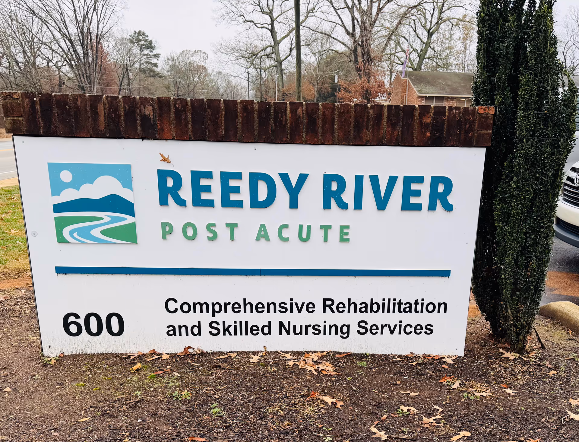 Outdoor sign for Reedy River Post Acute advertising rehabilitation and nursing services