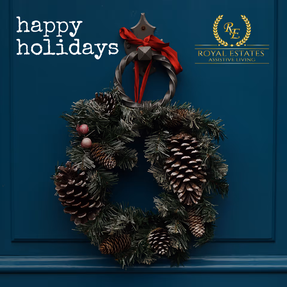 Blue front door with a holiday wreath, 'happy holidays' text, and Royal Estates Assisted Living logo.