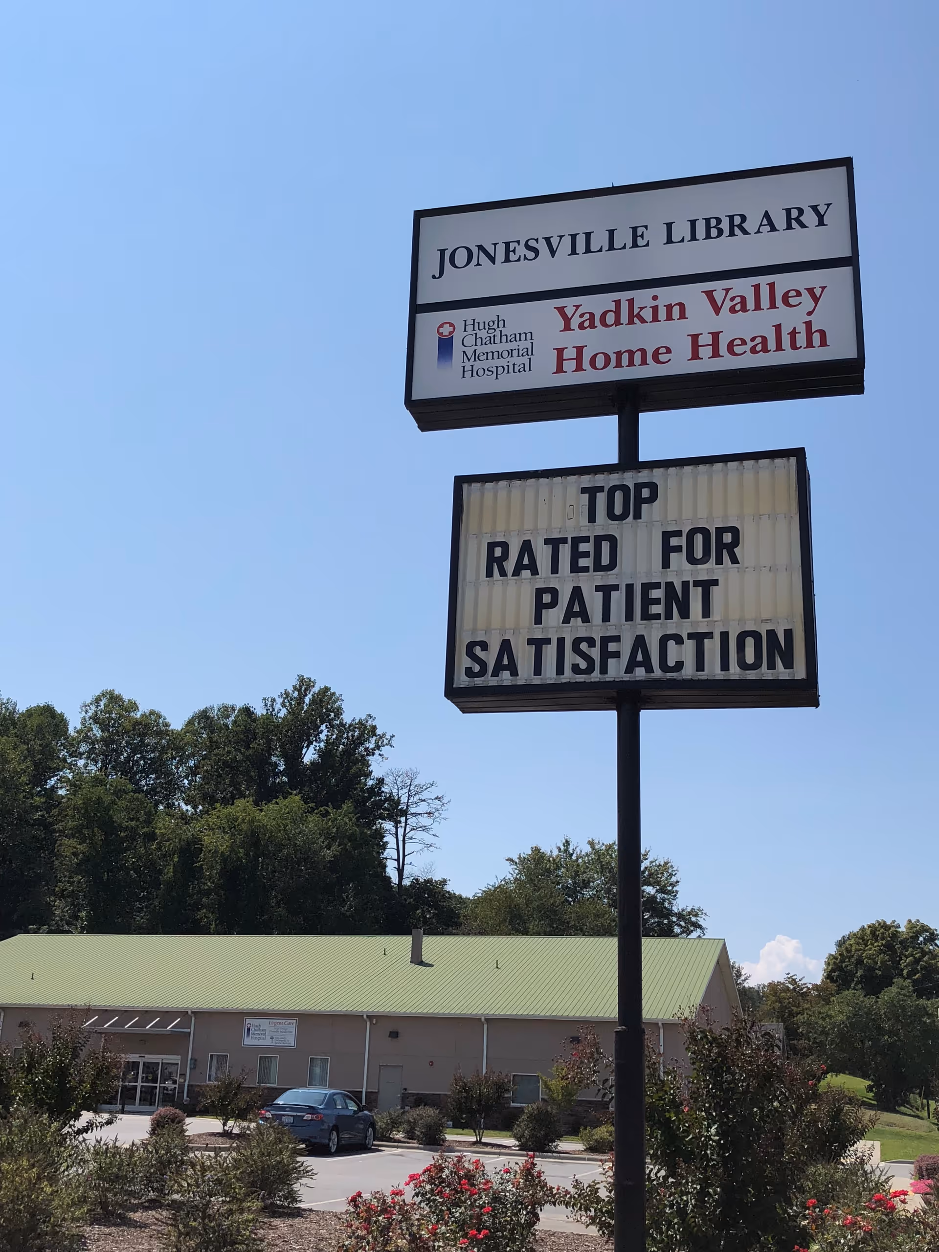 Tall sign reads Jonesville Library and Yadkin Valley Home Health outside a single-story building.
