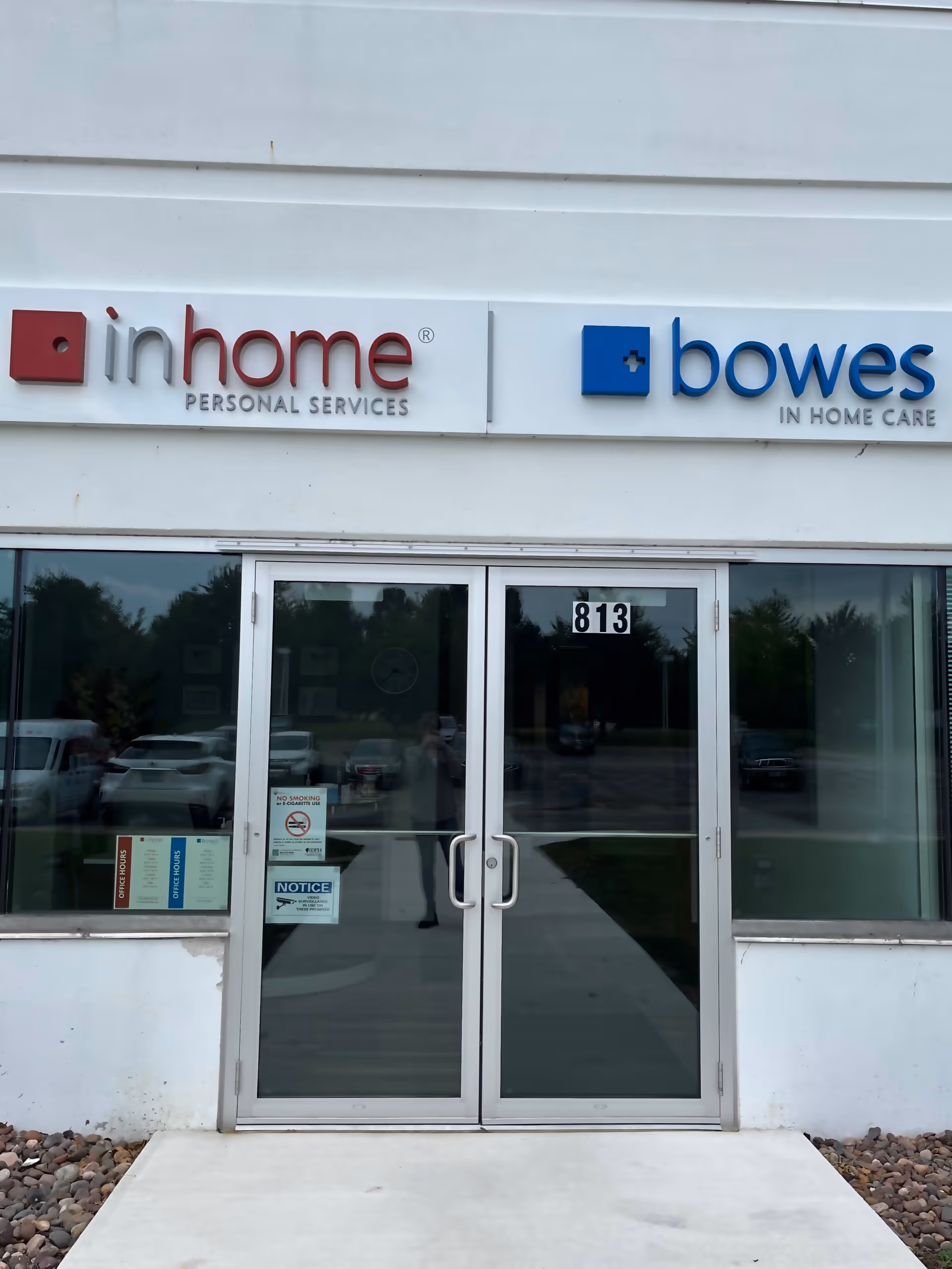Exterior storefront showing Bowes In Home Care sign and glass entrance doors.