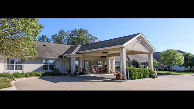 Exterior view of Vintage Park at Wamego with a covered entrance and landscaping.