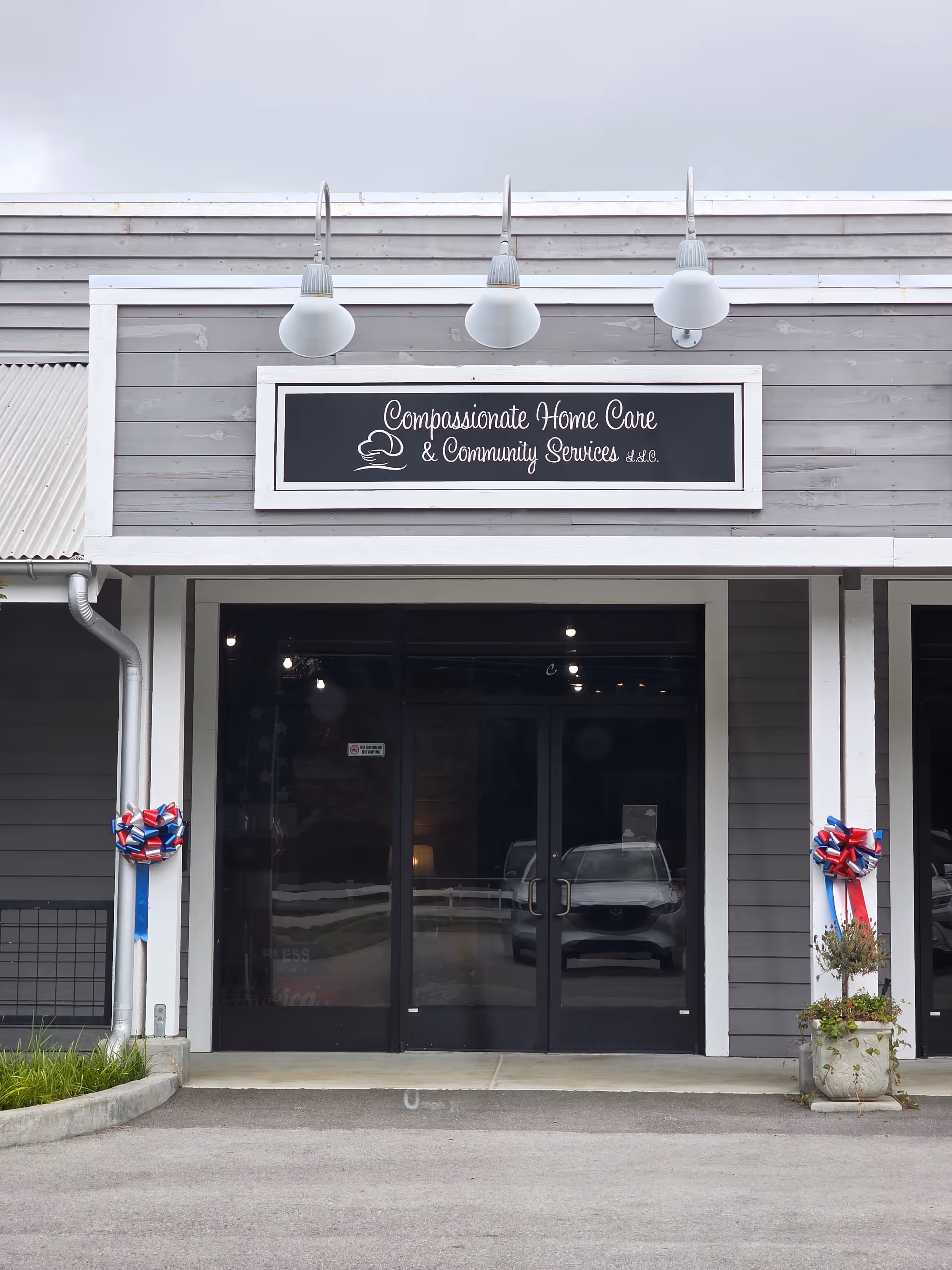 Exterior front of Compassionate Home Care & Community Services with double glass doors.