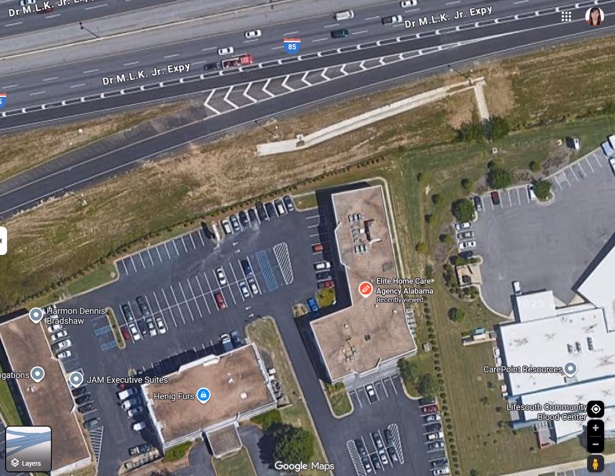 Aerial view of Elite Home Care Agency Alabama building with surrounding parking lots.