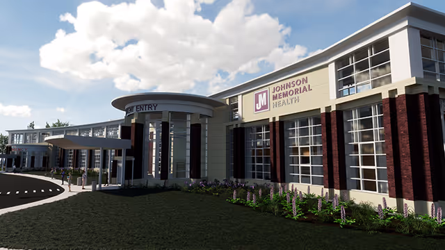 Exterior view of Johnson Memorial Health facility with entrance and landscaping