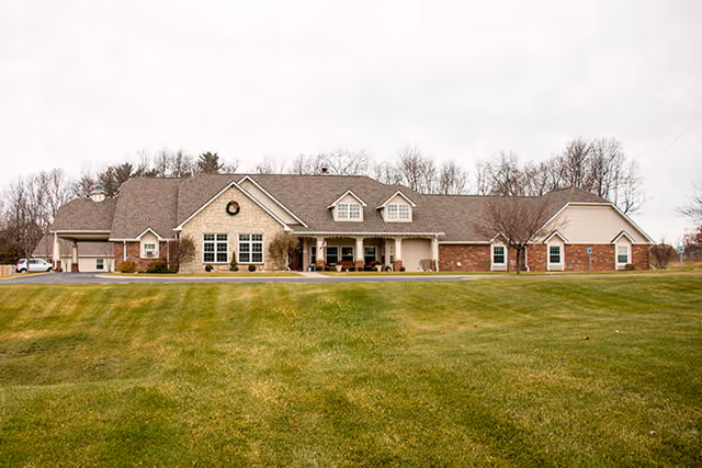 Front view of Brookdale South Bend senior living facility with a large lawn.