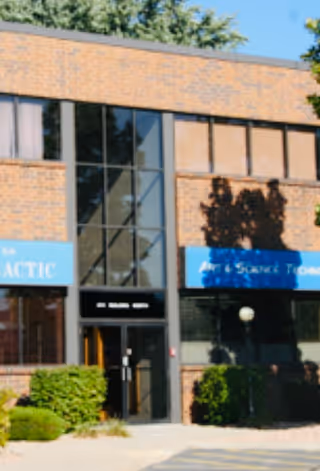 Exterior brick building with Ace Homemaker Service Inc. signs and glass entry.