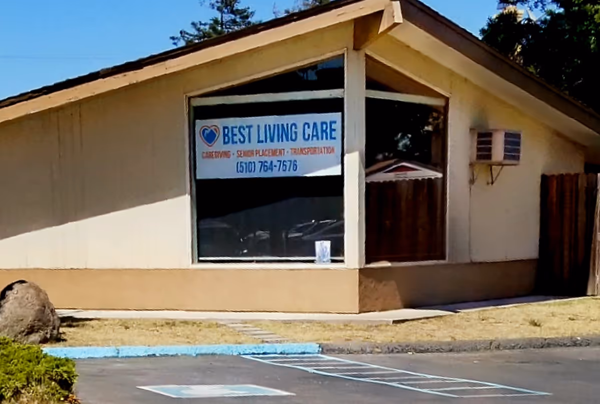 Single-story building exterior with Best Living Care sign on front window.