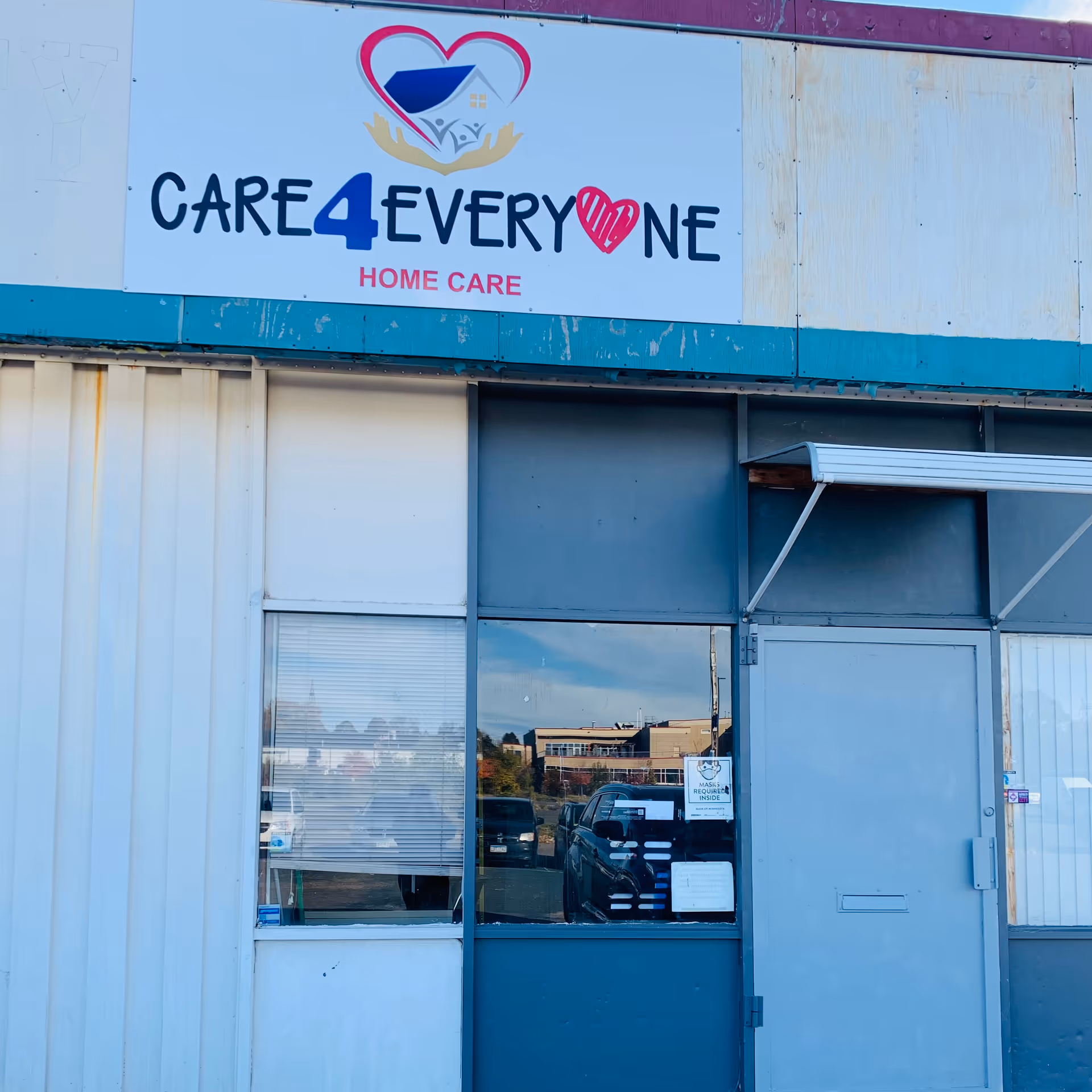 Front of a facility with CARE4EVERYONE Home Care sign on storefront