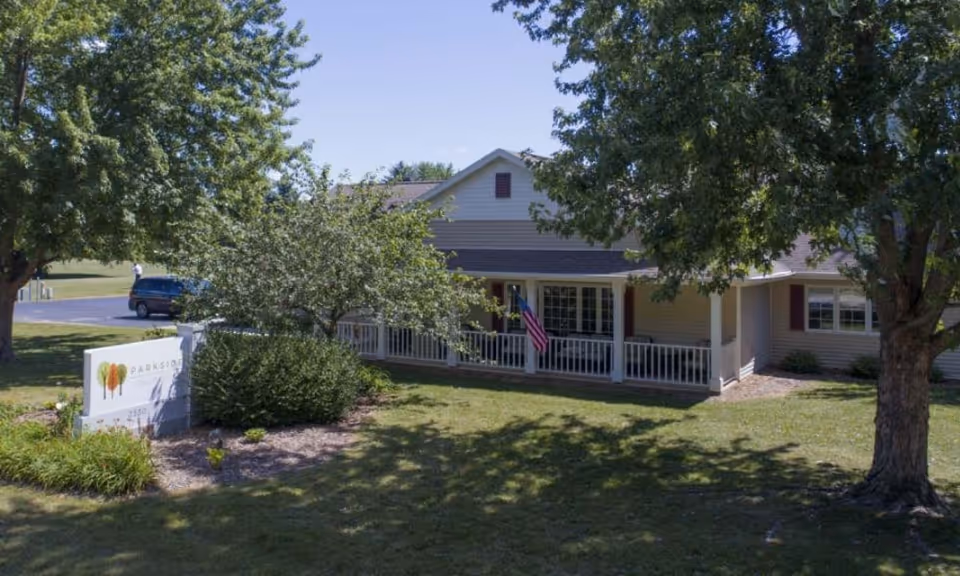 Front view of Aperion Care Lincoln building with porch and sign.