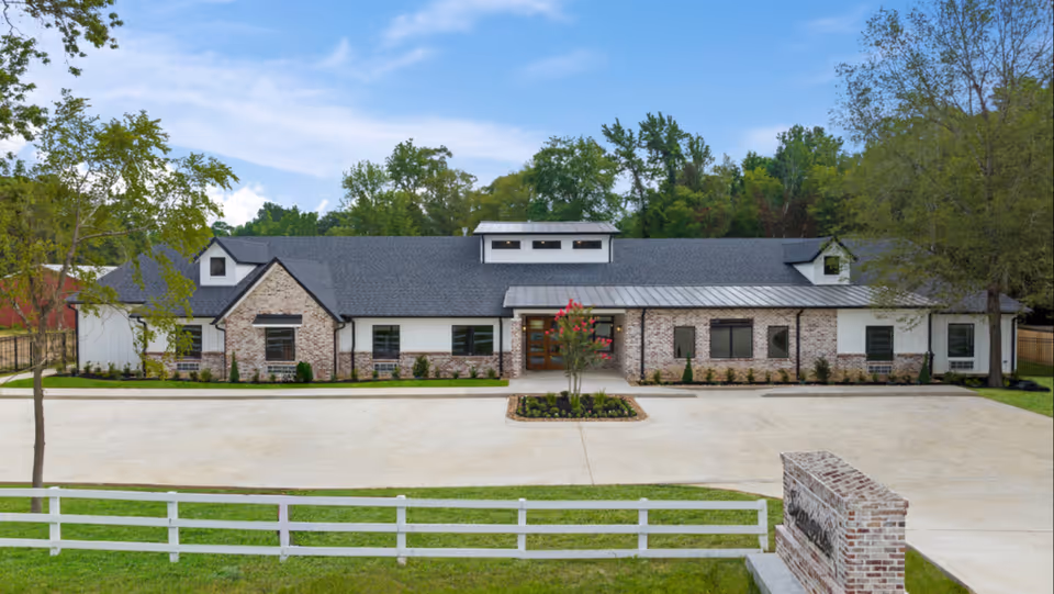 Seasons Assisted Living & Memory Care building front with driveway and landscaping