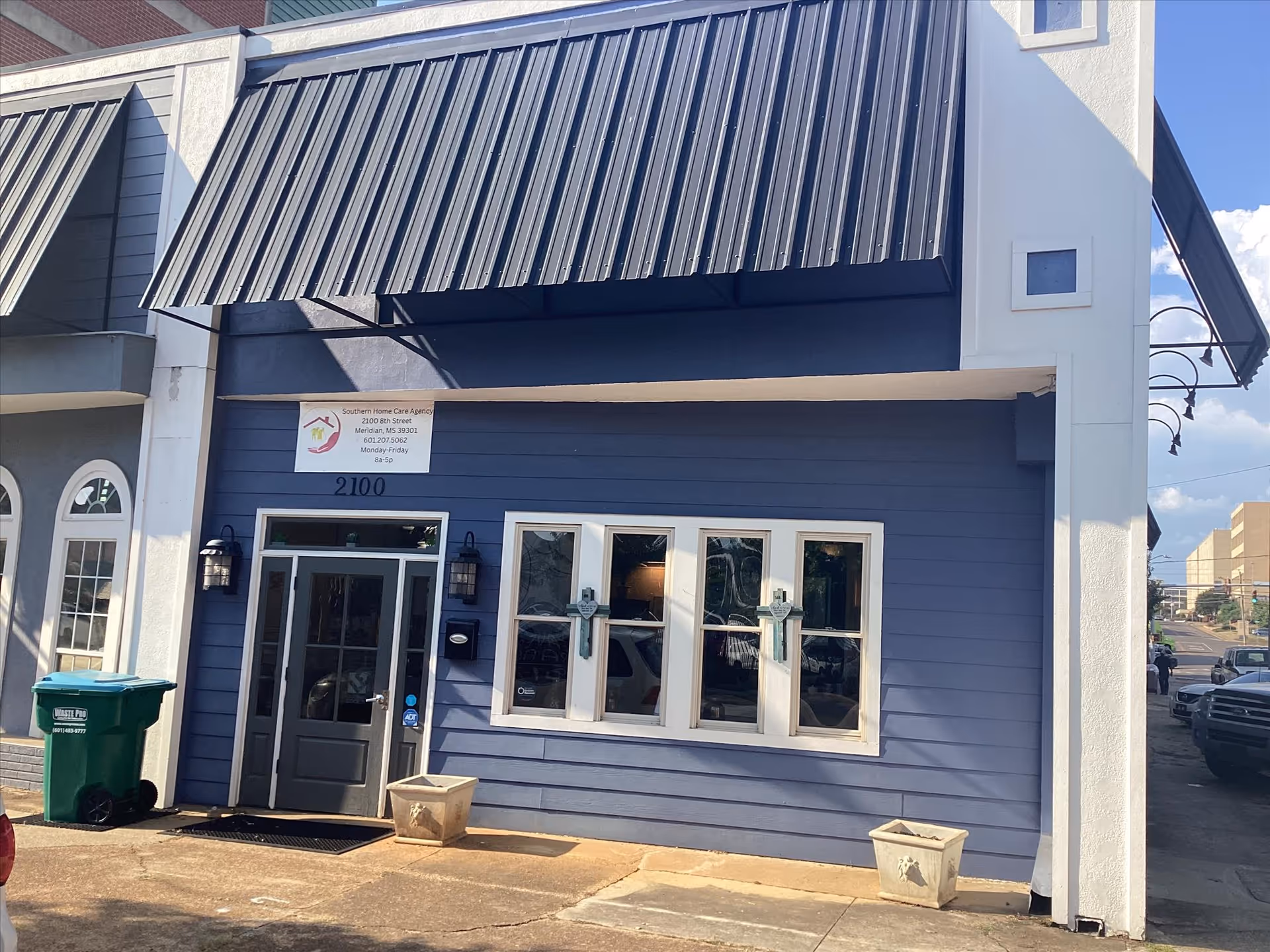 Blue storefront building with metal awning and signage for Southern Home Care Agency, LLC.