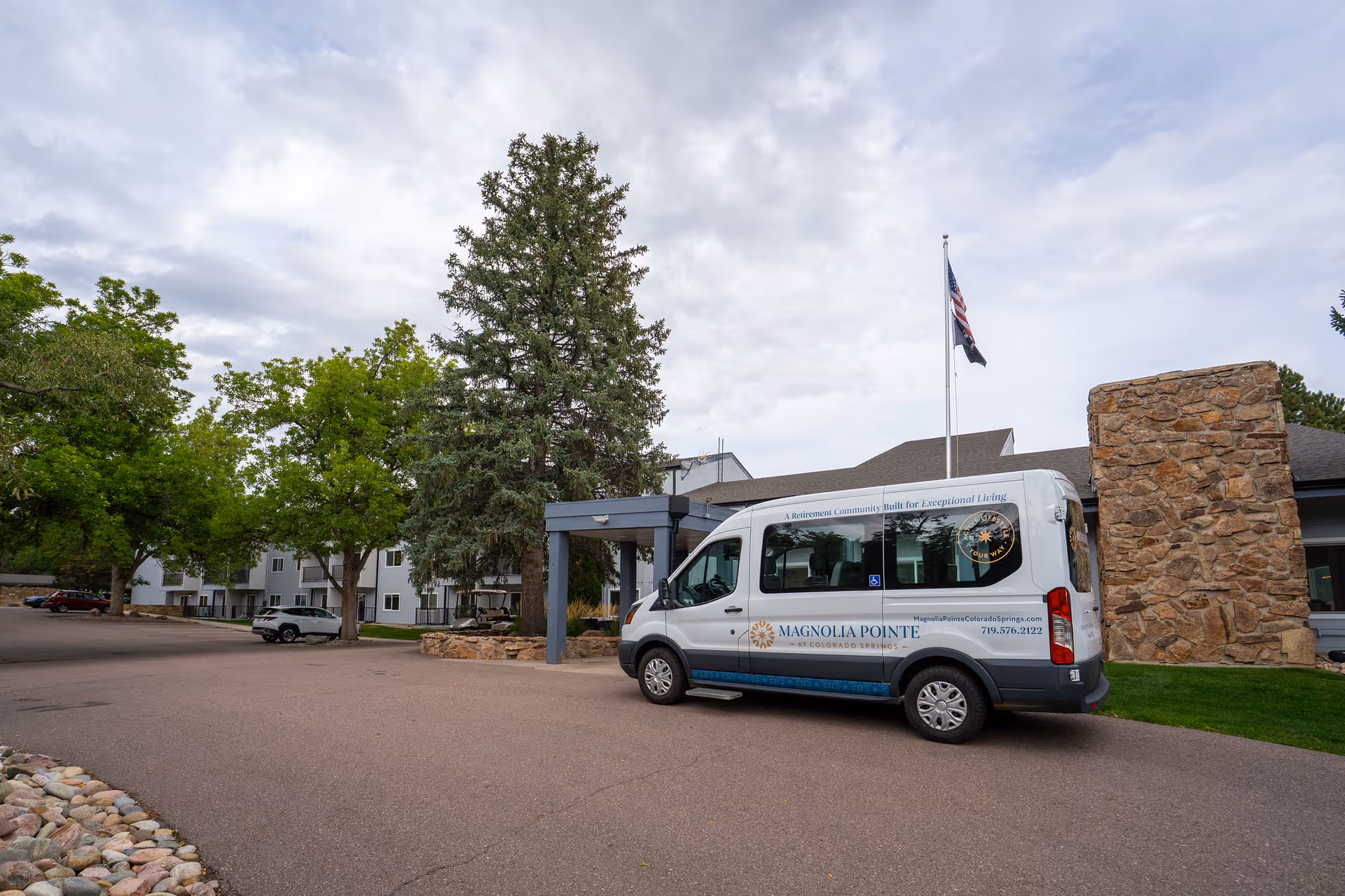 A van parked in front of Mountain View Independent Living facility entrance.