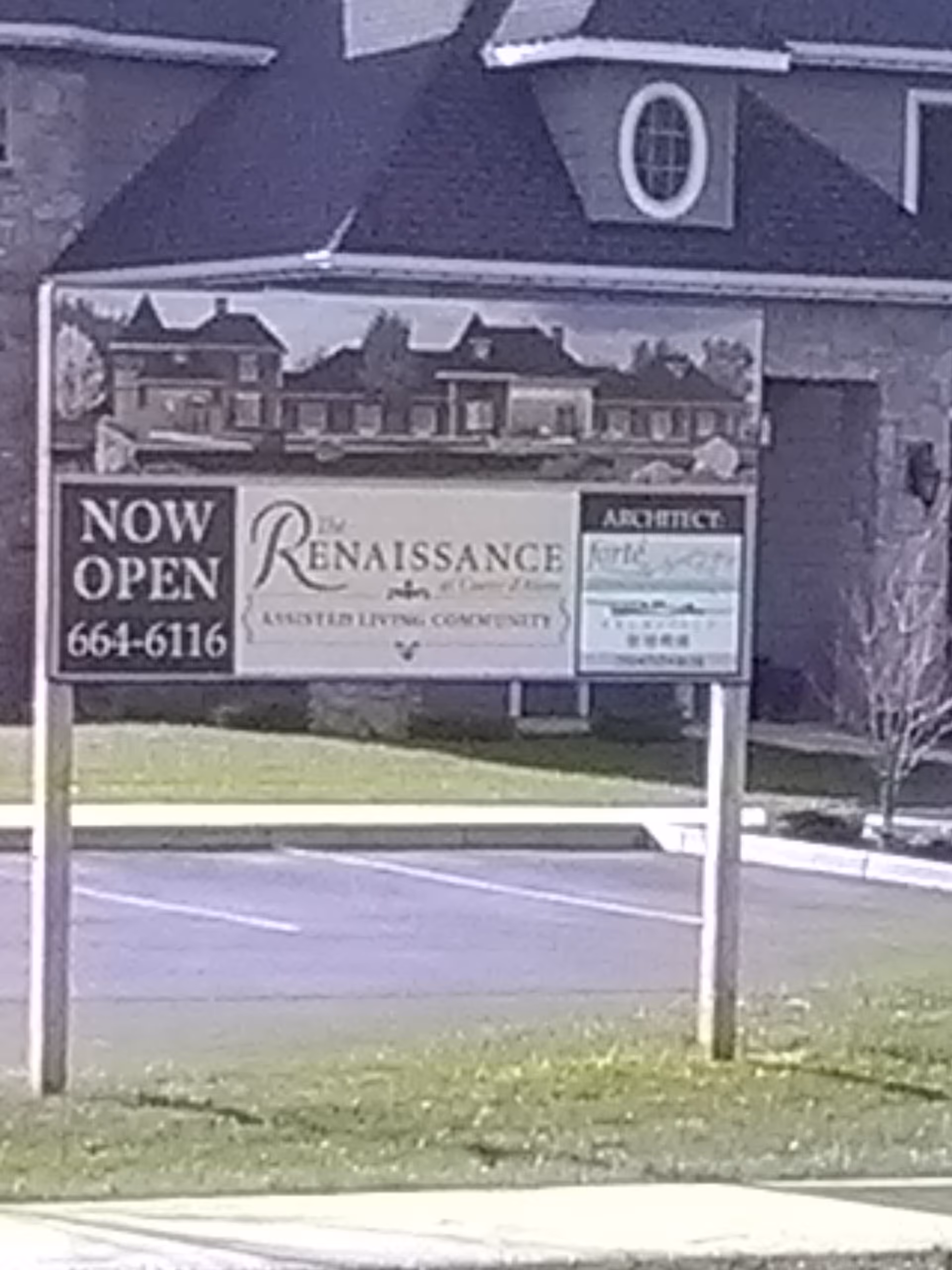 Exterior view of The Renaissance at Coeur D'Alene sign in front of building.