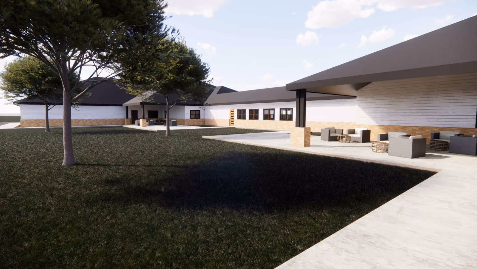 Outdoor patio with modern building, trees, and seating areas at Gigi's Place in Miamisburg, OH.