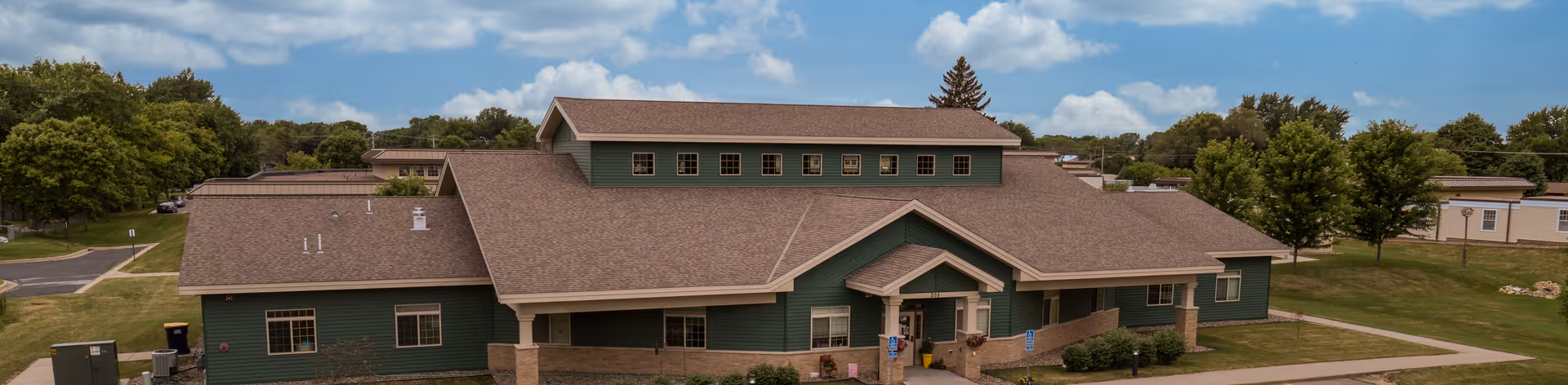 An aerial view of a green-roofed Trinity Care Center building.