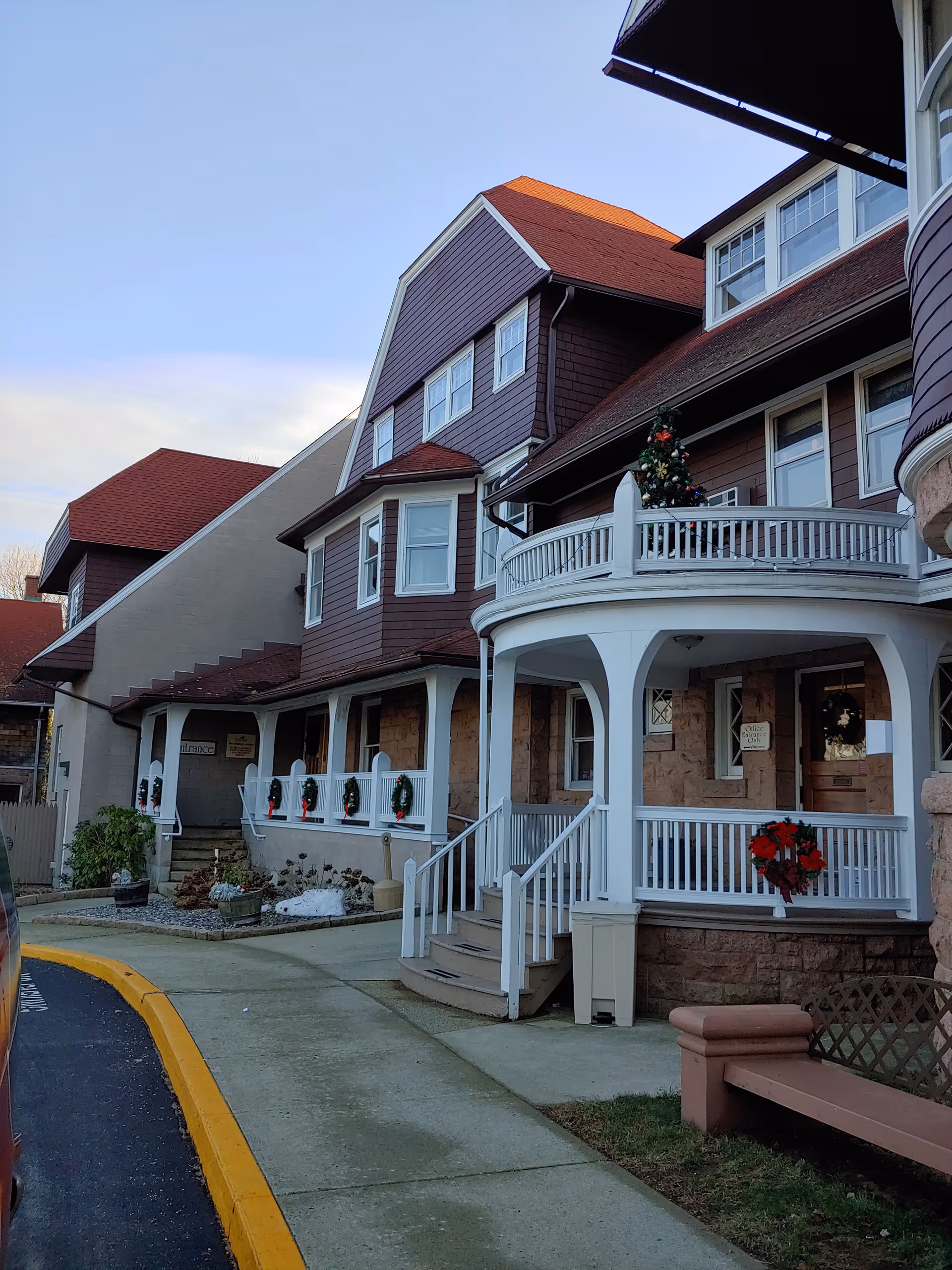 Exterior view of Beechwood senior living with a decorated front porch.