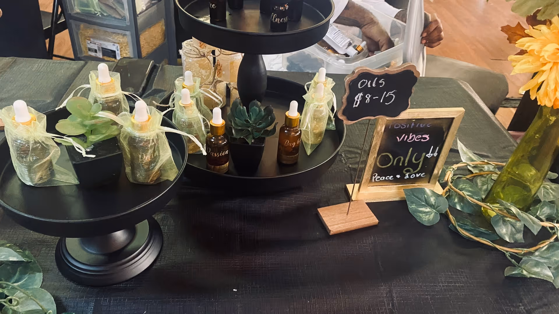 A table display of small bottle dropper products and decor indoors.