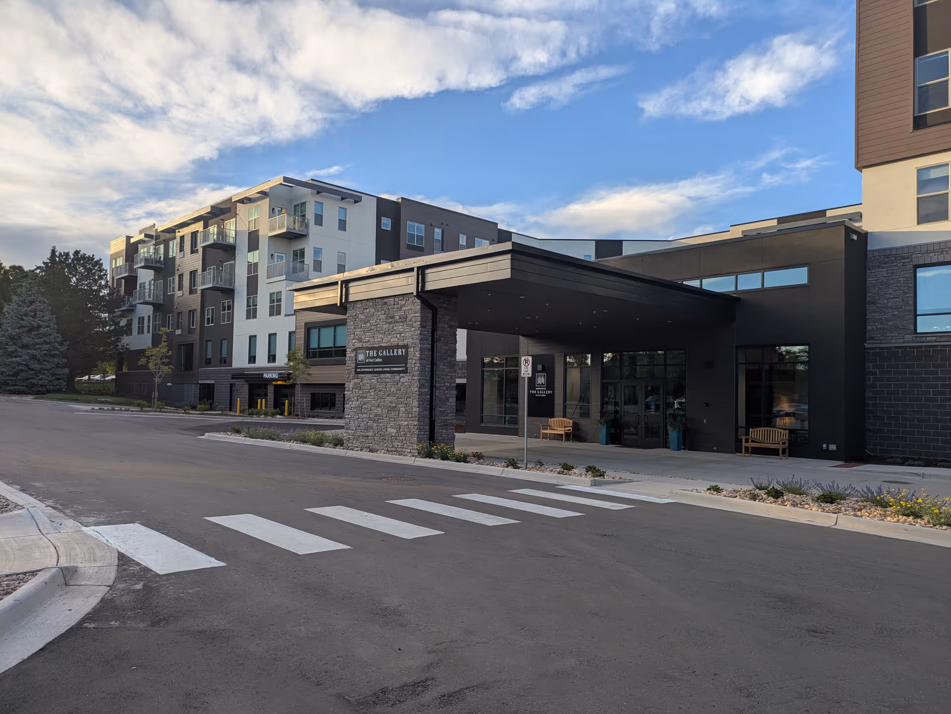Exterior view of The Gallery at Fort Collins Leasing Center with a covered entrance.