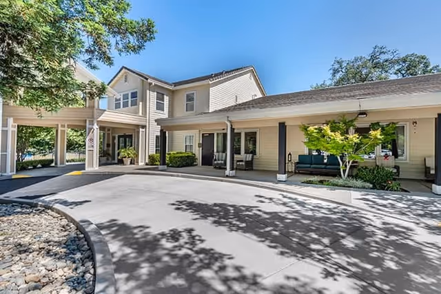Exterior view of Brookdale Folsom senior living facility featuring a landscaped entrance.