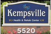 Blue sign reads Kempsville Health & Rehab Center atop a brick base.