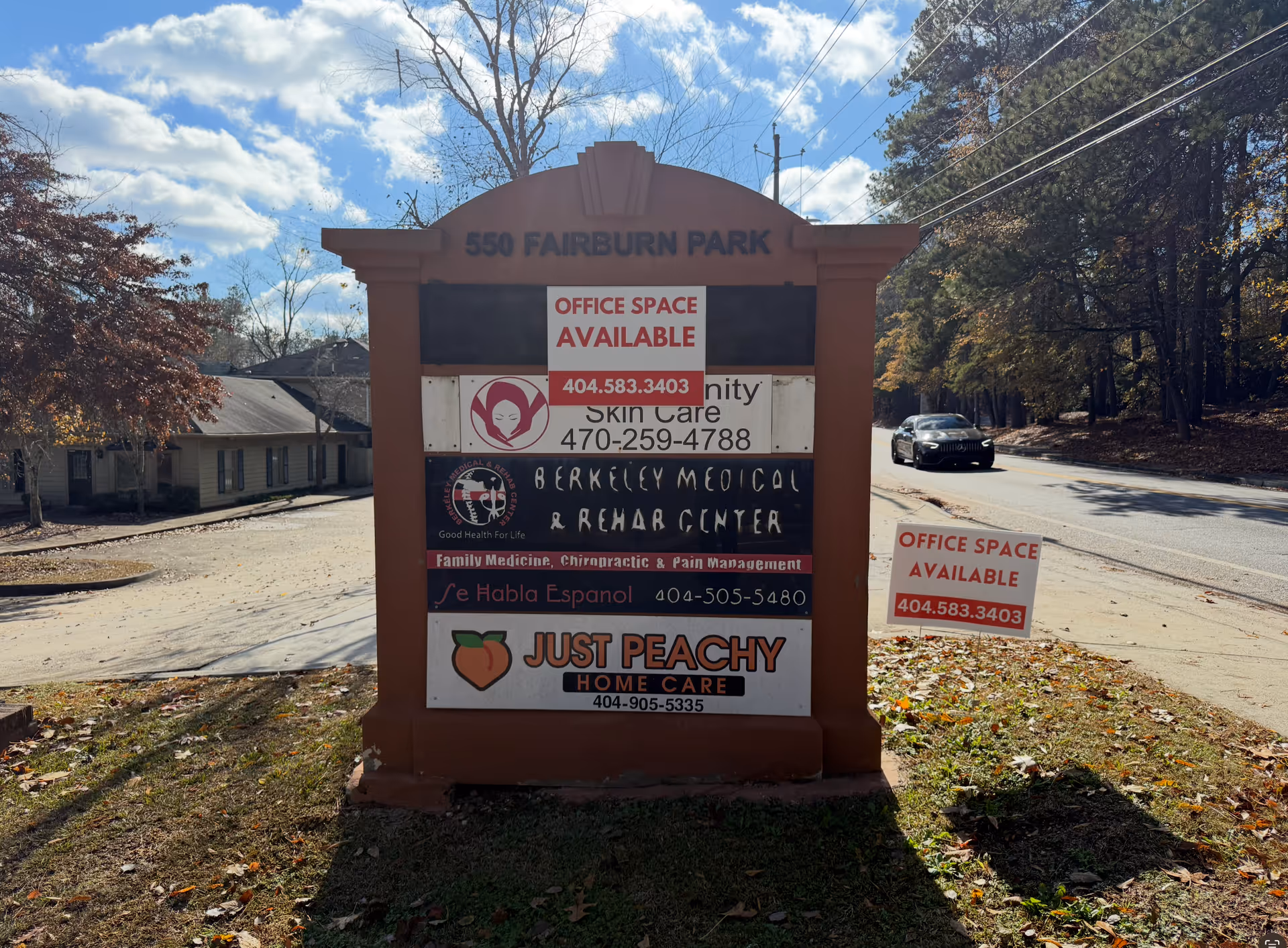 Roadside signboard for Just Peachy Home Care with neighboring business ads.