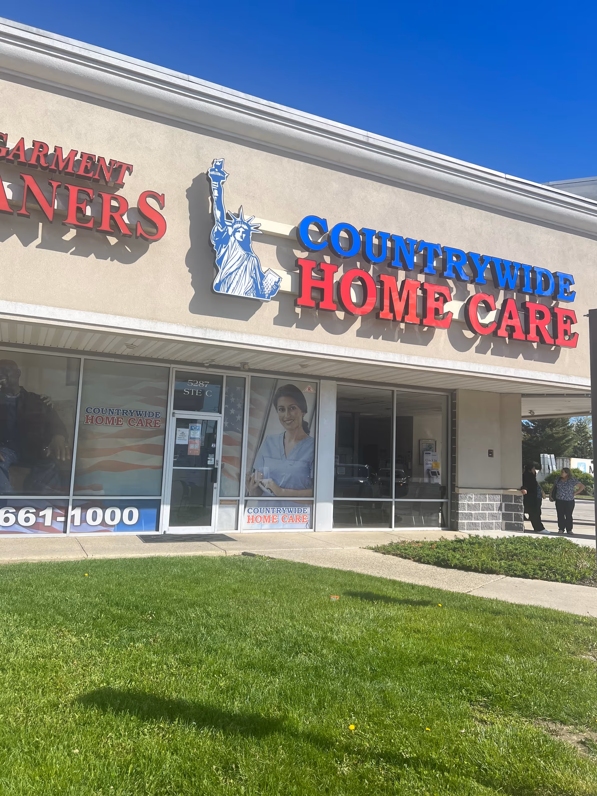 Exterior view of Countrywide Home Care storefront with large sign and glass doors