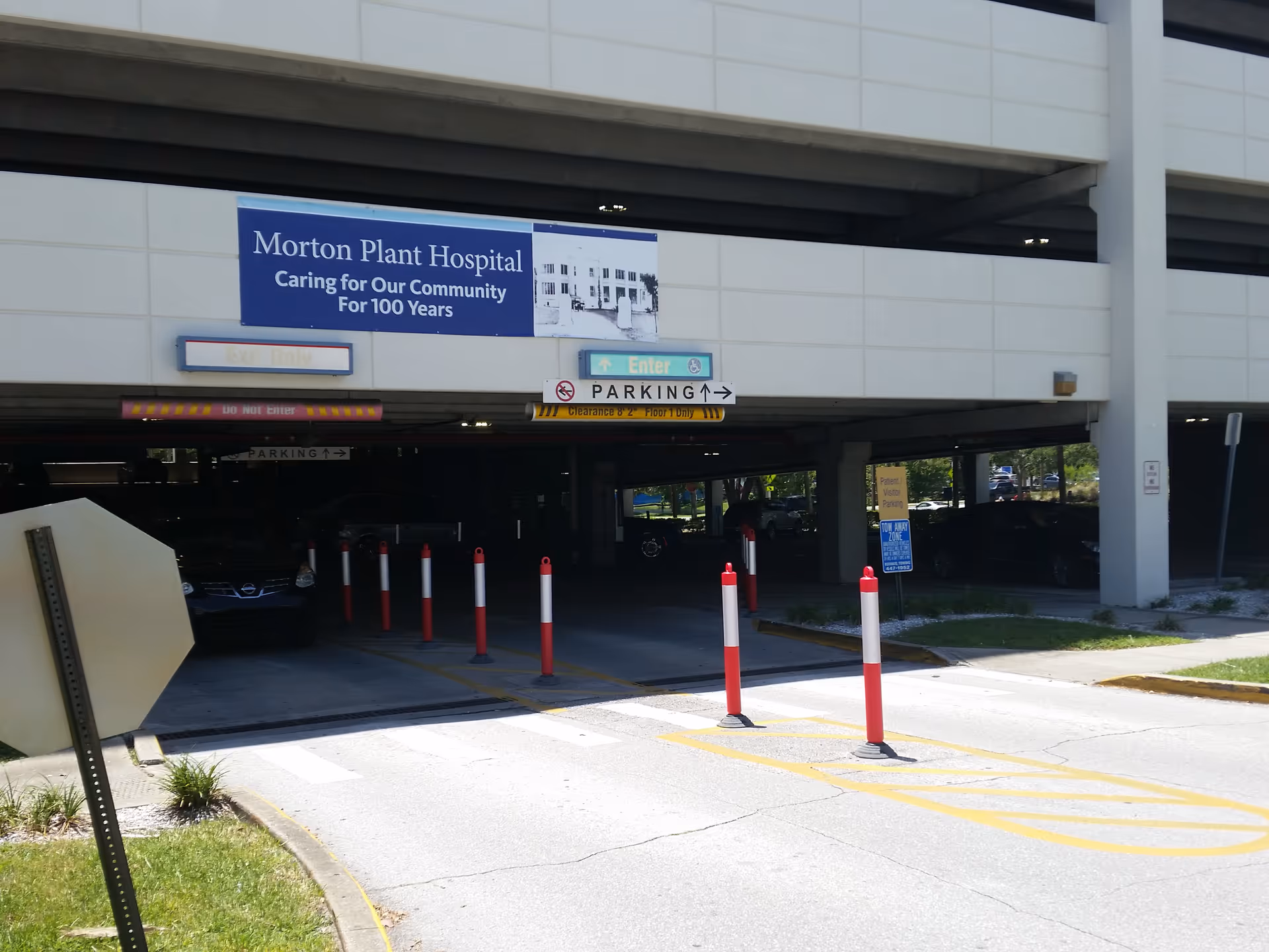 Exterior of a hospital parking entrance with Morton Plant Hospital sign