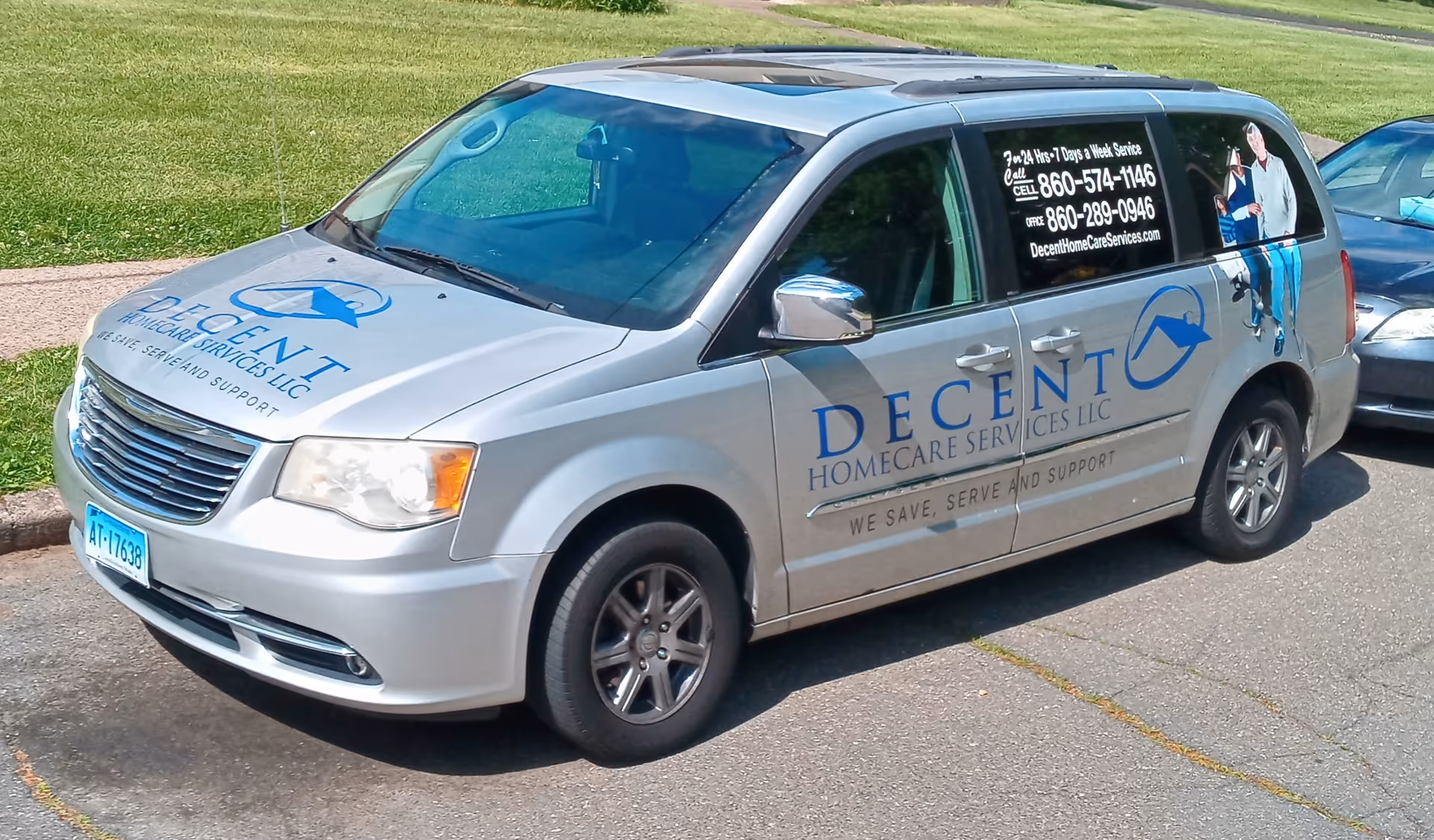Silver Decent Homecare Services LLC van with logo and contact numbers parked roadside