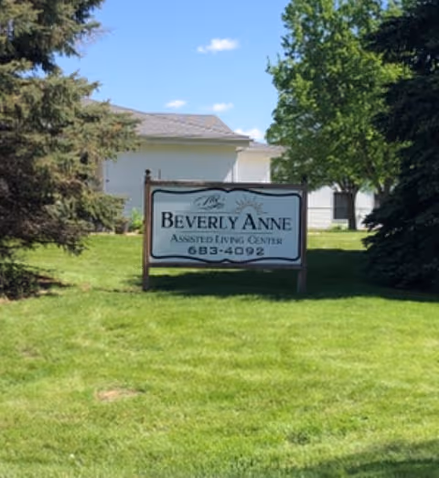 Front lawn with Beverly Anne Assisted Living sign and building in background.