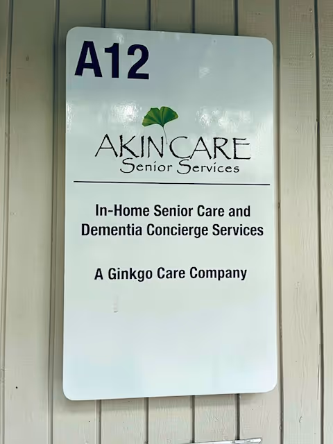 Exterior wall sign for AKIN CARE Senior Services with A12 unit number