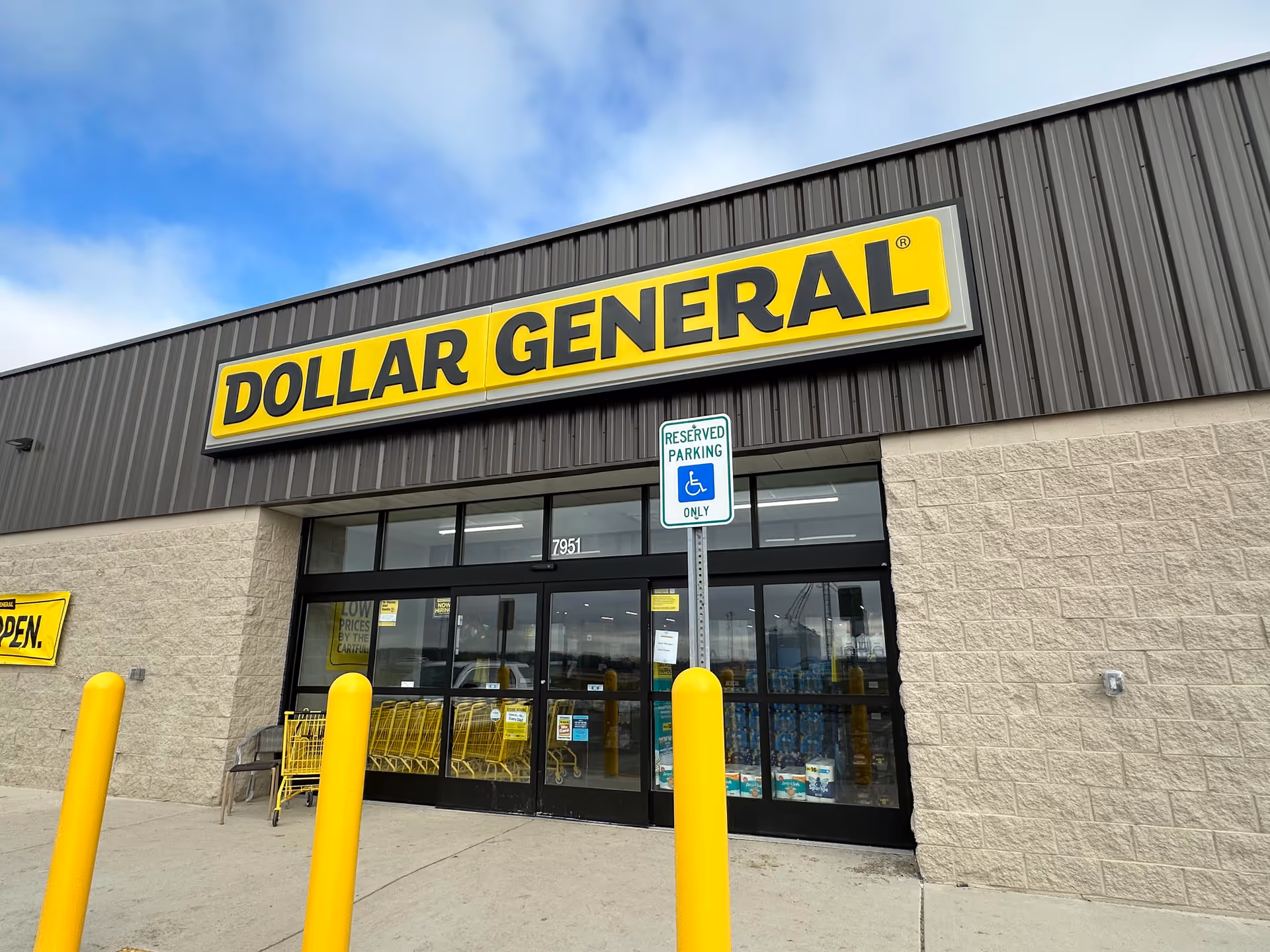 Dollar General storefront with large yellow sign and glass doors.