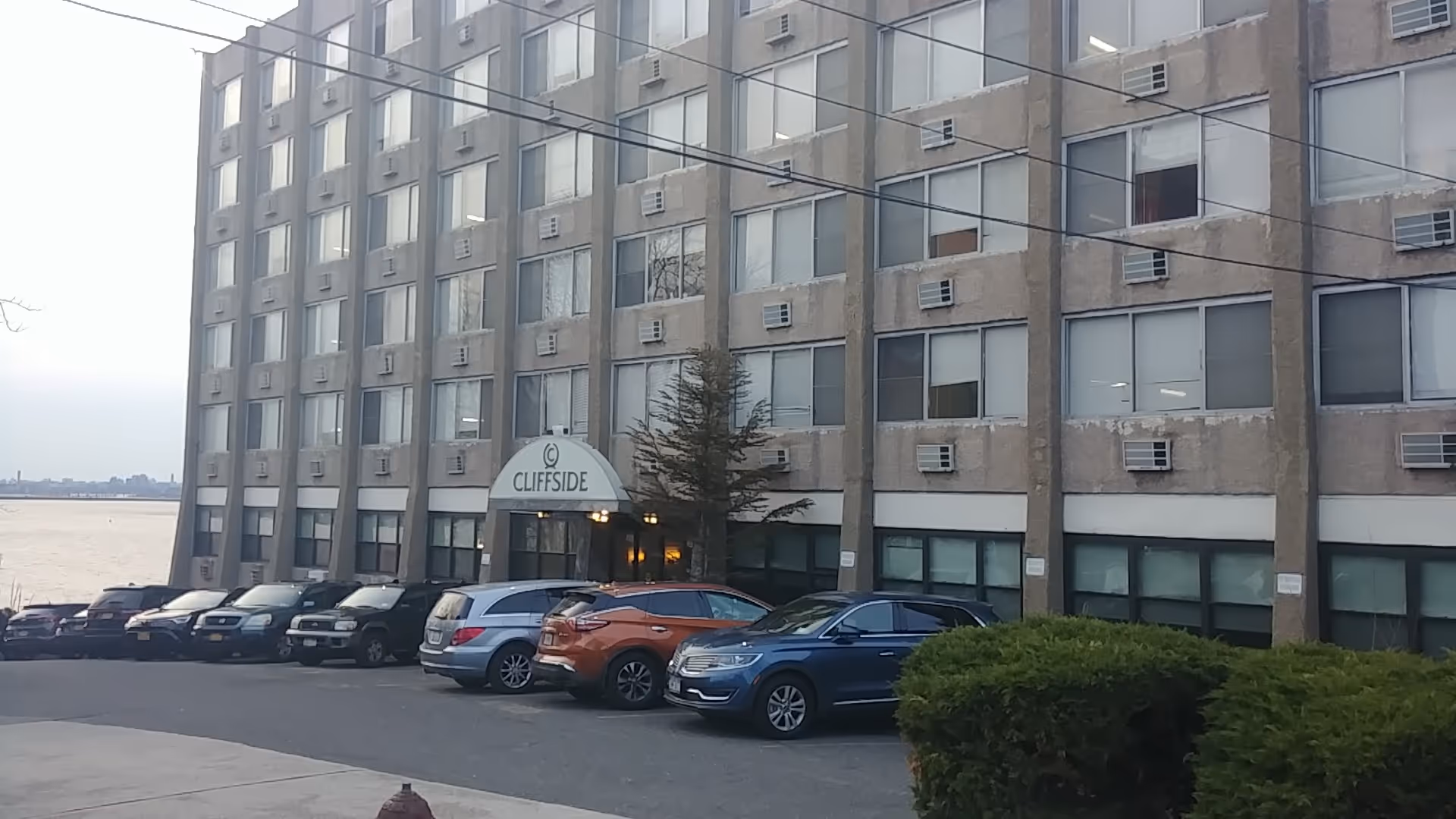 Cliffside Rehab and Residential Health Care Center entrance with parked cars in front.